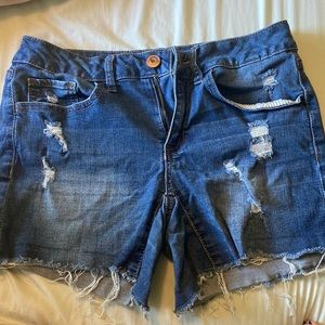 Jean shorts, medium wash distressed.